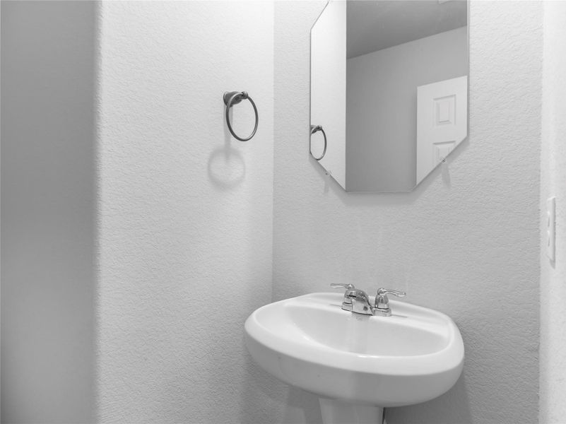 Convenient downstairs half bath.