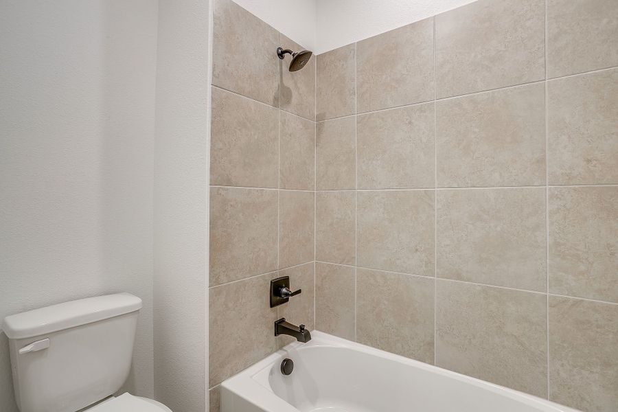 Representative furnished interior of a home built from the Valera by Graham Hart Home Builder in Bear Ridge, Burleson (Image 4).