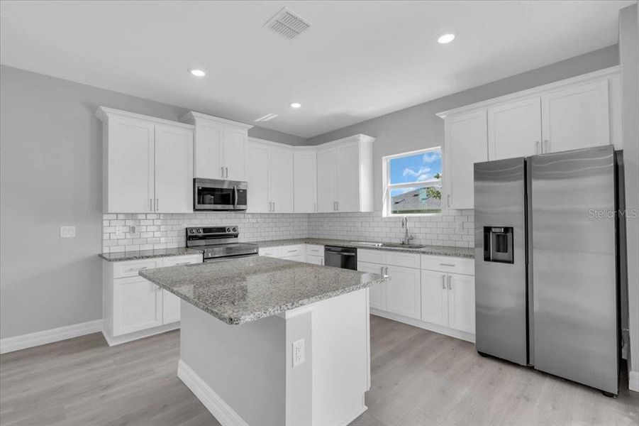 Furnished interior view inside a new home in , Punta Gorda (Image 13). Furnished interior view inside a new home in , Punta Gorda (Image 13).