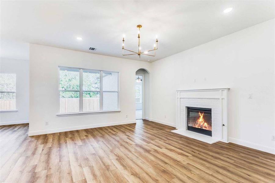 Unfurnished living room with plenty of natural light and light hardwood / wood-style floors