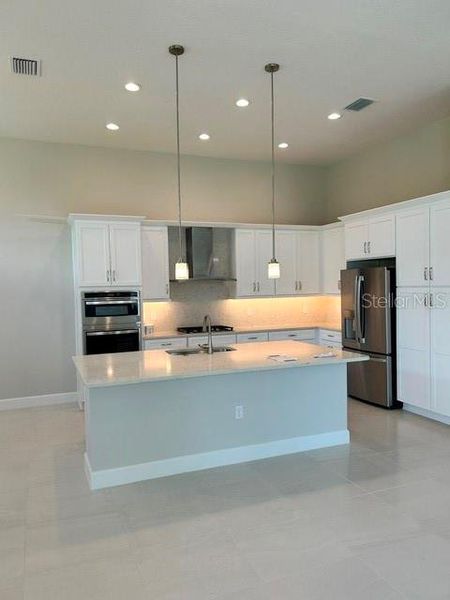 Furnished interior view inside a new home in Valencia Ridge (55+), Wesley Chapel (Image 4).