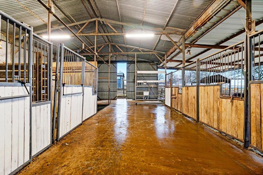 Concrete breezeway in lighted barn. Concrete breezeway in lighted barn.