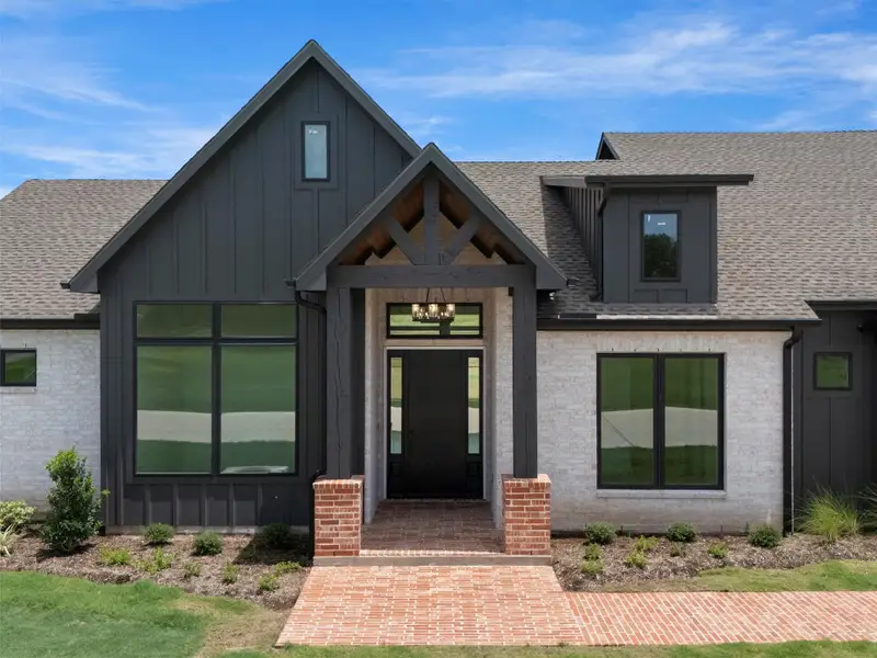 Front exterior of a new home in , Smithville, TX, highlighting curb appeal (Image 28).