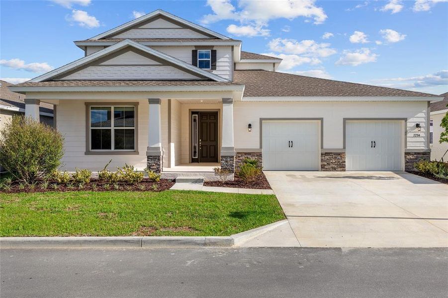 Front exterior of a new home in Calesa Township, Ocala, FL, highlighting curb appeal (Image 20). Front exterior of a new home in Calesa Township, Ocala, FL, highlighting curb appeal (Image 20).