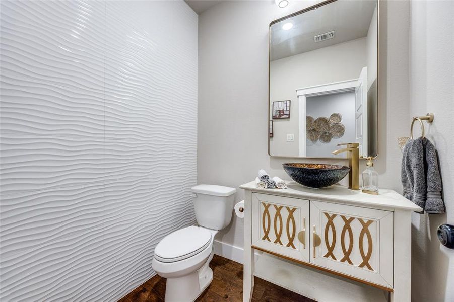 Bathroom with vanity and dark wood-style floors