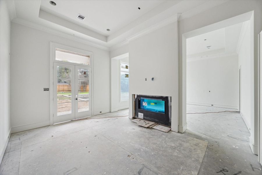 Progress photo from December 2025 - Primary bedroom with sitting area and double-sided fireplace