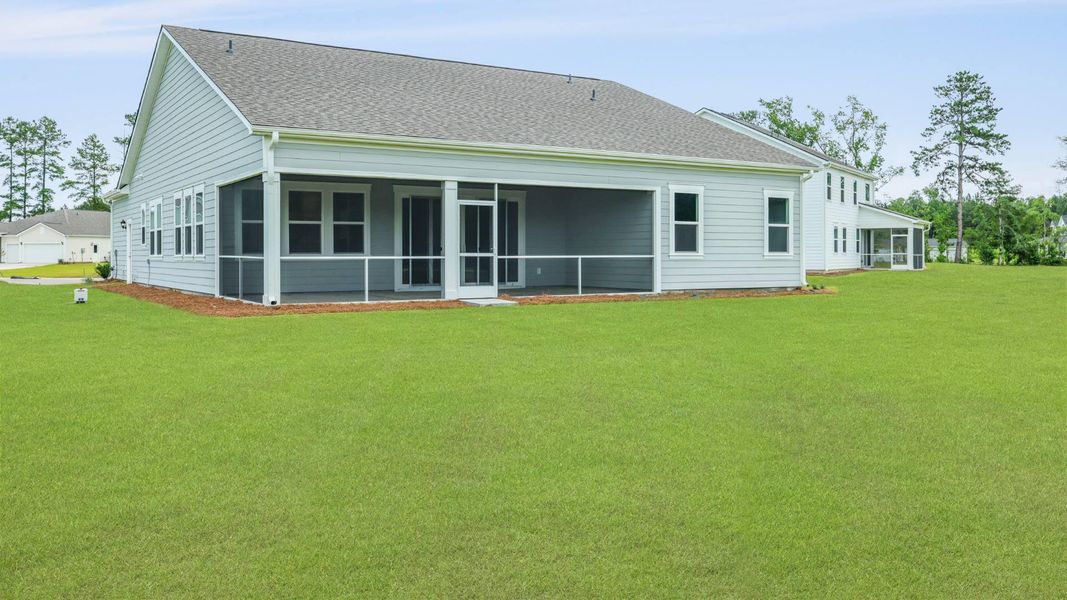 Front exterior of a new home in Berkeley Bay, Ridgeville, SC, highlighting curb appeal (Image 20).