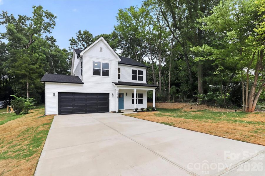Front exterior of a new home in , Belmont, NC, highlighting curb appeal (Image 24).