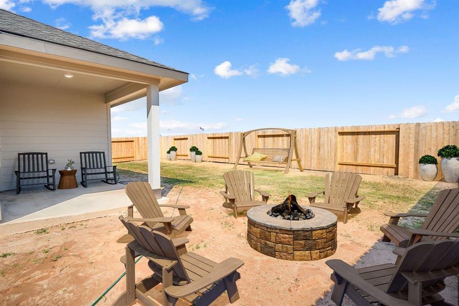 Come and see this spacious backyard with its beautiful covered patio. There is plenty of room for the kids to play and adults to relax!