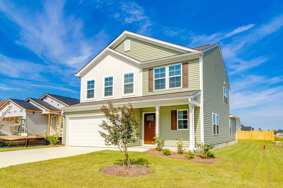 Front exterior of a new home in Winston Point, Gilbert, SC, highlighting curb appeal (Image 17). Front exterior of a new home in Winston Point, Gilbert, SC, highlighting curb appeal (Image 17).