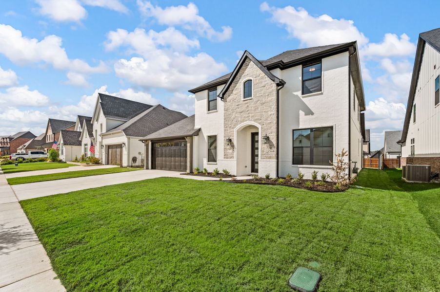 Front exterior of a new home in Parks of Aledo, Aledo, TX, highlighting curb appeal (Image 23).