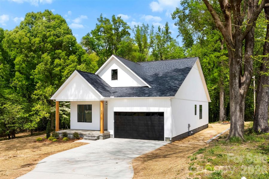 Front exterior of a new home in , Landis, NC, highlighting curb appeal (Image 25).