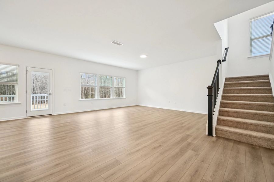 Family Room featuring the AW Collection® Roosevelt - Warm finishes make this room hosting-ready.