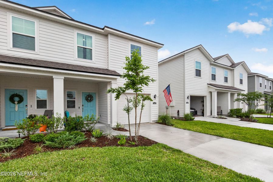 Front exterior of a new home in , Jacksonville, FL, highlighting curb appeal (Image 27).