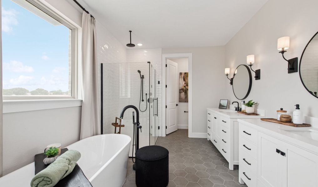 Primary bath with freestanding vanity and hexagonal tile Primary bath with freestanding vanity and hexagonal tile