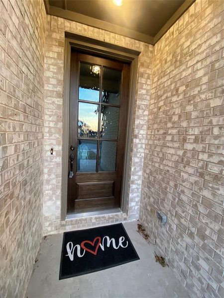 Impressive 8ft mision style front door welcomes your guests