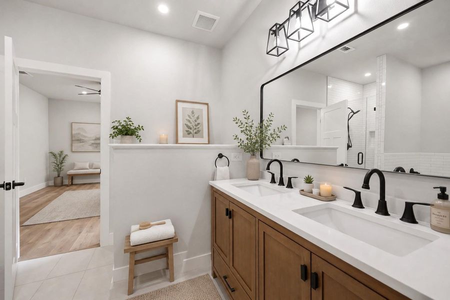 A sleek dual vanity and framed mirror elevate this contemporary primary bathroom. A sleek dual vanity and framed mirror elevate this contemporary primary bathroom.