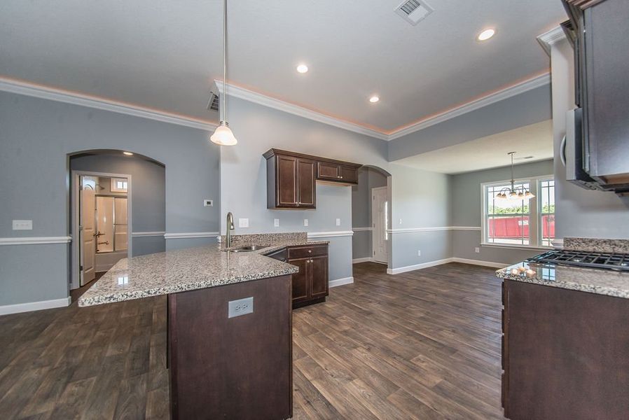 Representative furnished interior of a home built from the Jackson by Enchanted Homes in Lonesome Dove, San Antonio (Image 10).