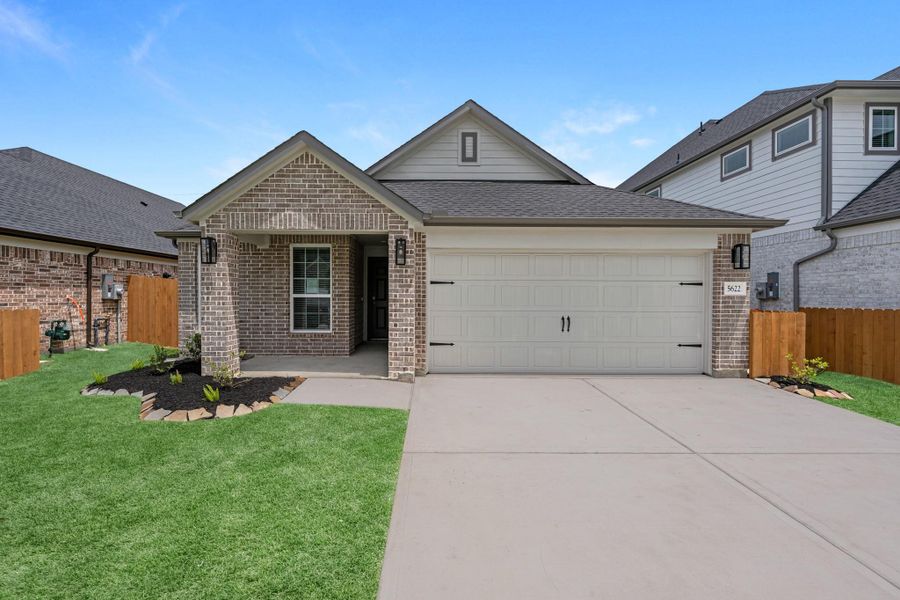 Front exterior of a new home in Grand Mason Crossing, Katy, TX, highlighting curb appeal (Image 2). Front exterior of a new home in Grand Mason Crossing, Katy, TX, highlighting curb appeal (Image 2).