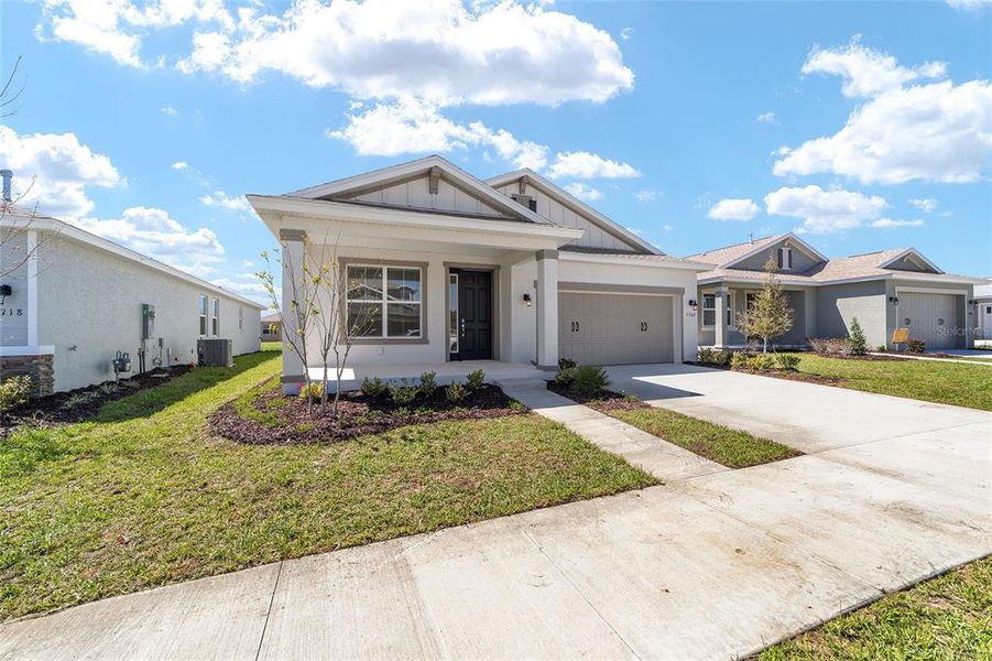 Front exterior of a new home in Calesa Township, Ocala, FL, highlighting curb appeal (Image 22).