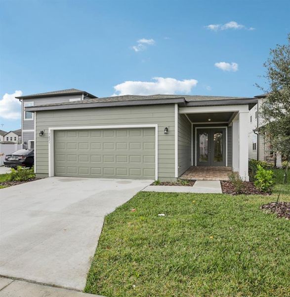 Front exterior of a new home in , Winter Garden, FL, highlighting curb appeal (Image 22).