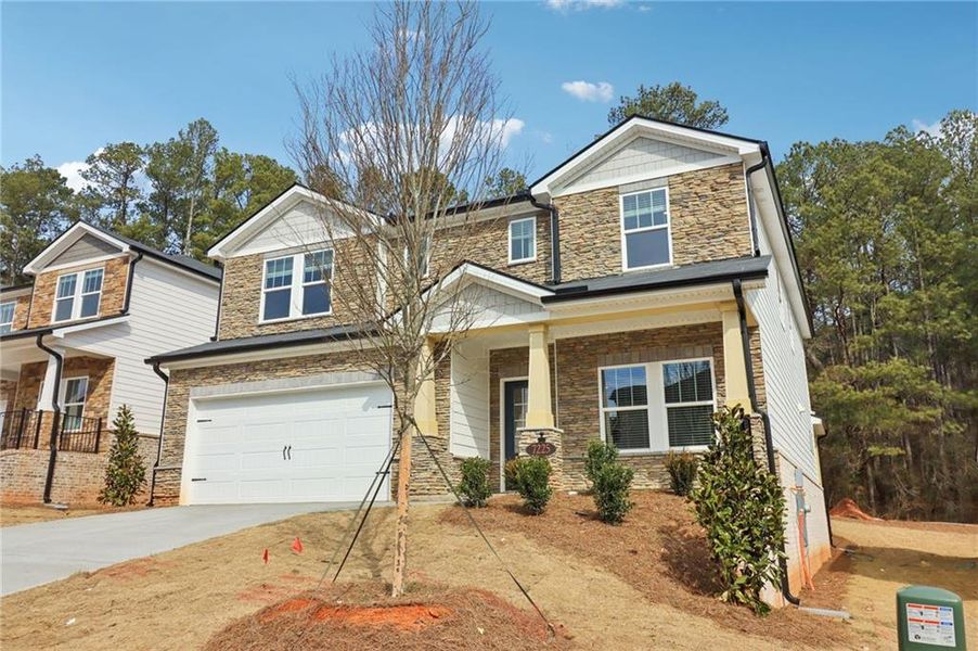 Front exterior of a new home in Harmony Manor, Fairburn, GA, highlighting curb appeal (Image 27).