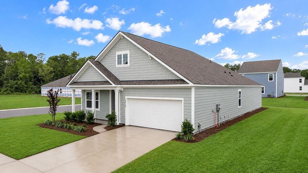 Front exterior of a new home in Hillcrest, Ravenel, SC, highlighting curb appeal (Image 2). Front exterior of a new home in Hillcrest, Ravenel, SC, highlighting curb appeal (Image 2).