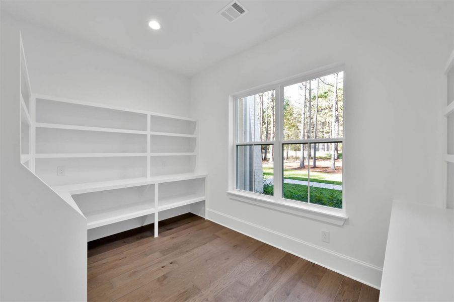 Fabulous chef's pantry is light, bright with custom shelves lining the walls. Fabulous chef's pantry is light, bright with custom shelves lining the walls.