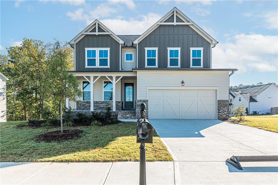Front exterior of a new home in The Village at Shallowford, Kennesaw, GA, highlighting curb appeal (Image 1). Front exterior of a new home in The Village at Shallowford, Kennesaw, GA, highlighting curb appeal (Image 1).