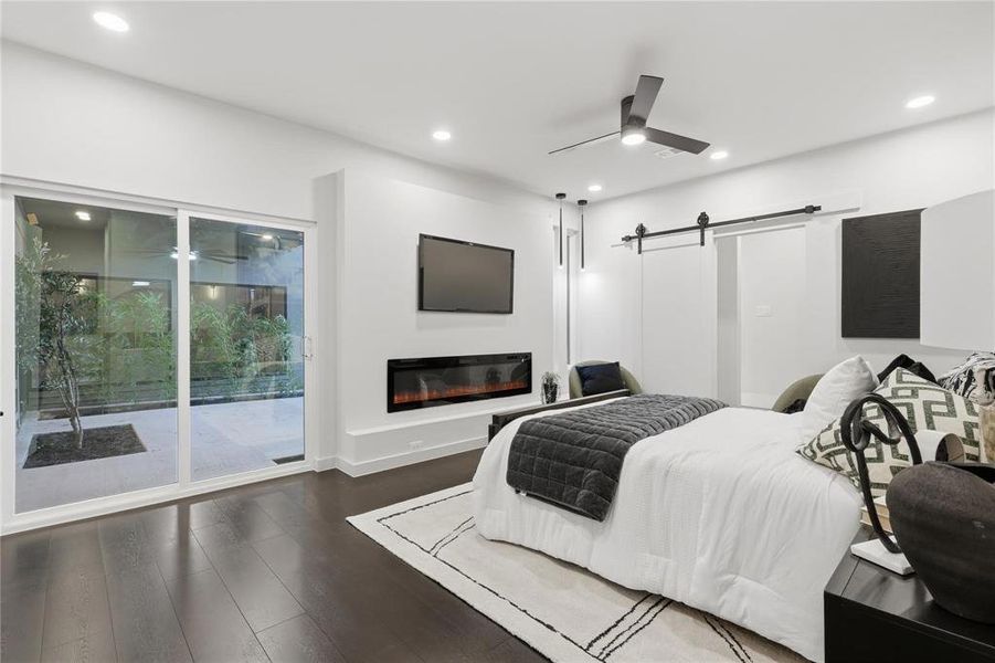 Modern interior with dark wood-finish flooring and recessed lighting