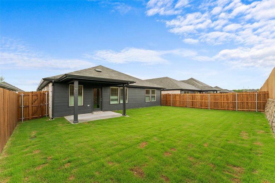 Rear view of property with a patio area and a fenced backyard Rear view of property with a patio area and a fenced backyard