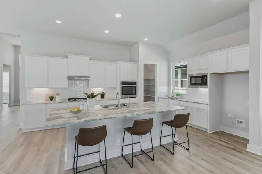Representative furnished interior of a home built from the Hampton by Chesmar Homes in Esperanza 50's, Boerne (Image 4).