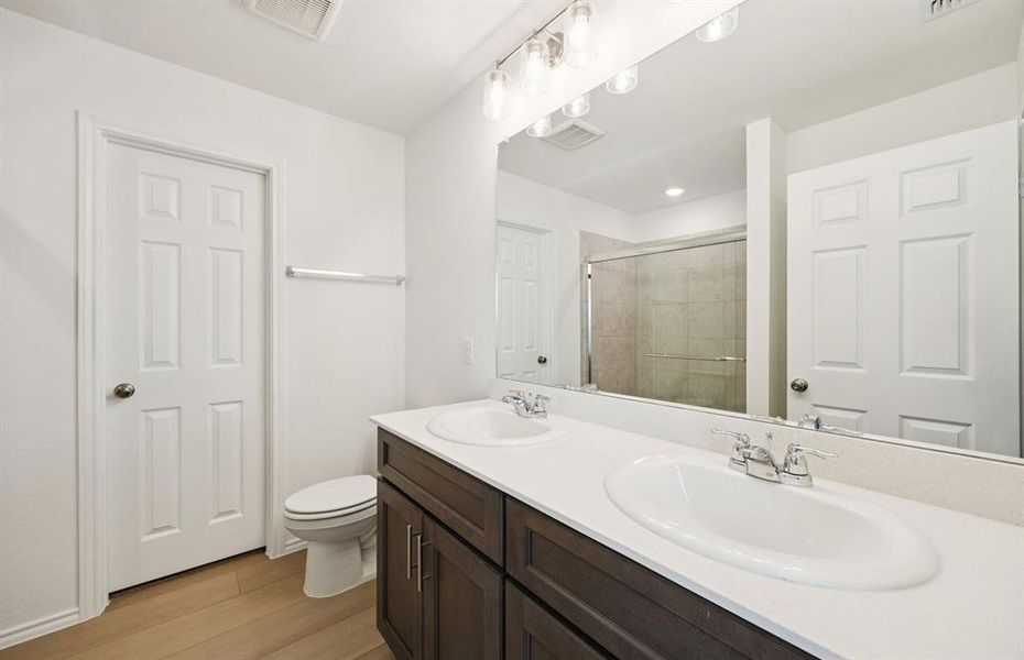 Elegant owner's bathroom with dual vanity