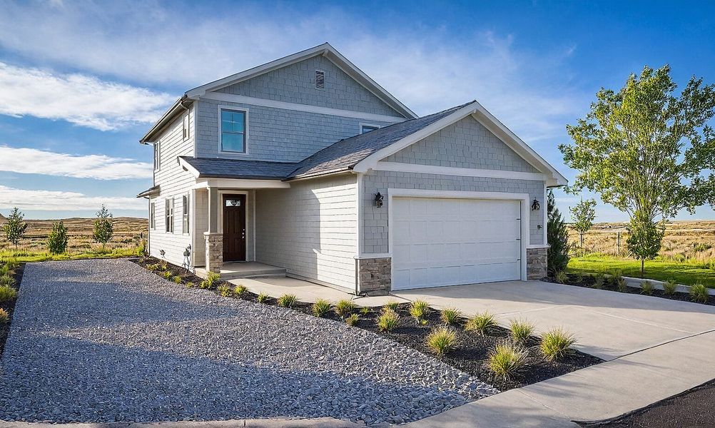 Front exterior of a new home in Trails at Aspen Ridge-3, Colorado Springs, CO, highlighting curb appeal (Image 1).