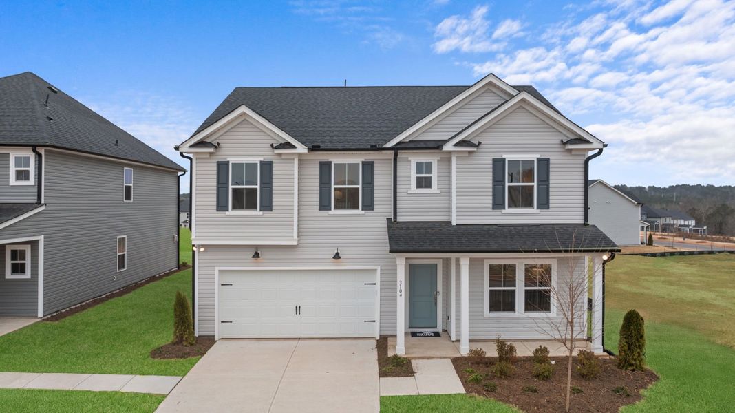 Front exterior of a new home in Solana, Durham, NC, highlighting curb appeal (Image 19).