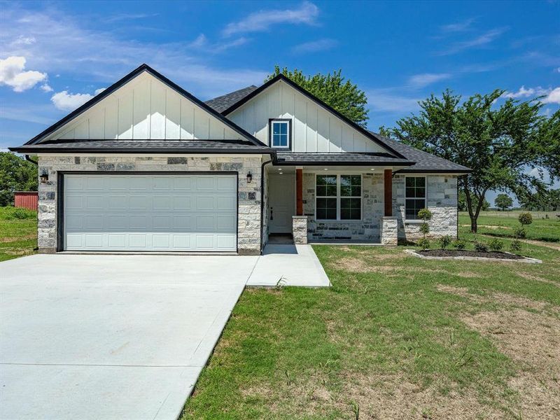 Front exterior of a new home in , Bowie, TX, highlighting curb appeal (Image 16).