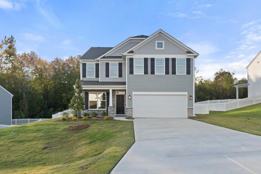 Front exterior of a new home in Cottages at Piper Village, Trinity, NC, highlighting curb appeal (Image 1).