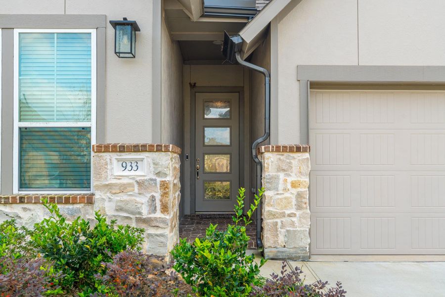 Exterior details and patio area of a home in Grand Central Park, Conroe (Image 3).