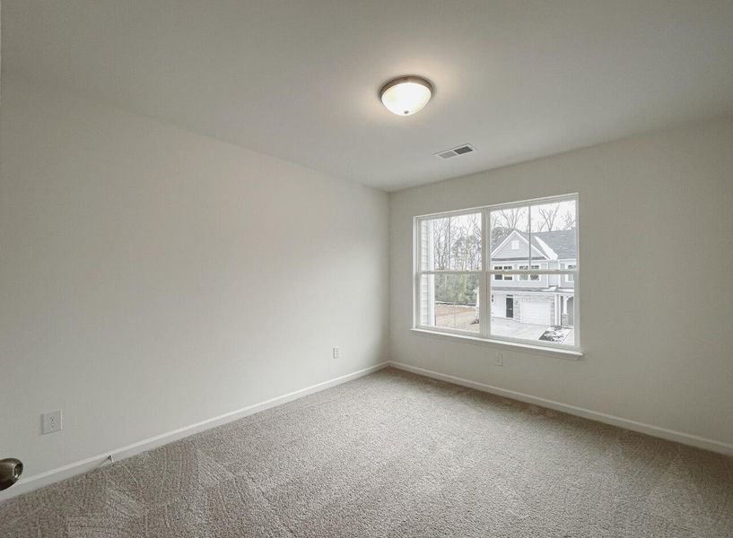 Spacious, unfurnished interior of a new home in East Main Townes, Spartanburg (Image 22).