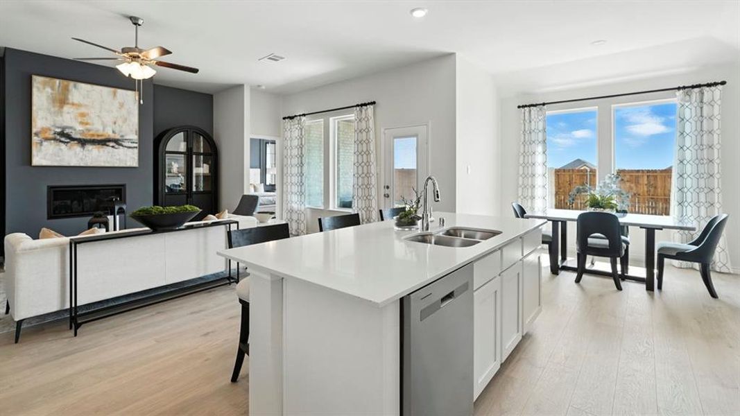 Open-concept living space featuring light wood-finish flooring