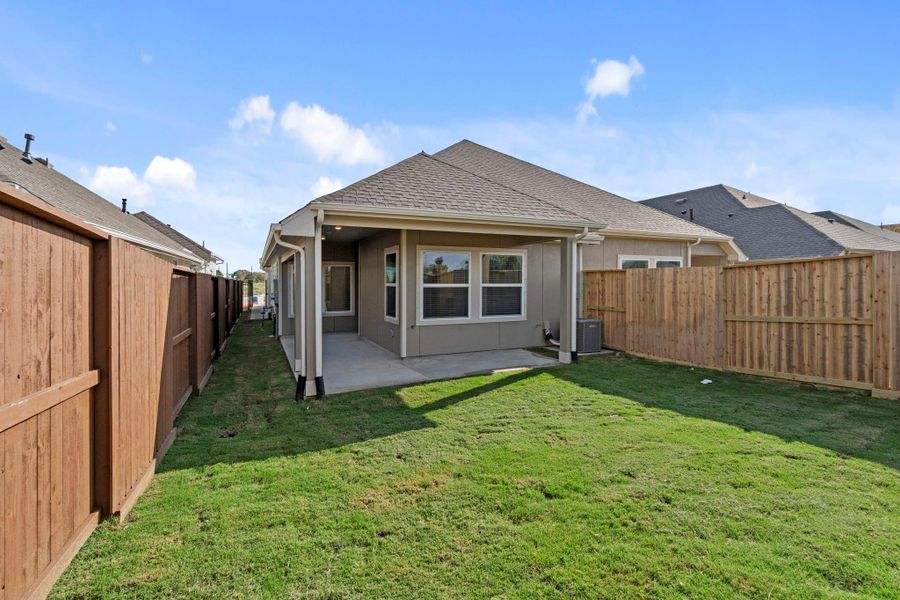Exterior details and patio area of a home in Meridiana, Iowa Colony (Image 3).