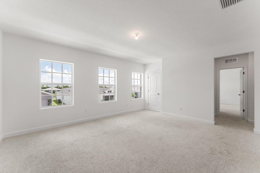 Spacious, unfurnished interior of a new home in Tradition - Cadence, Port St. Lucie (Image 11).