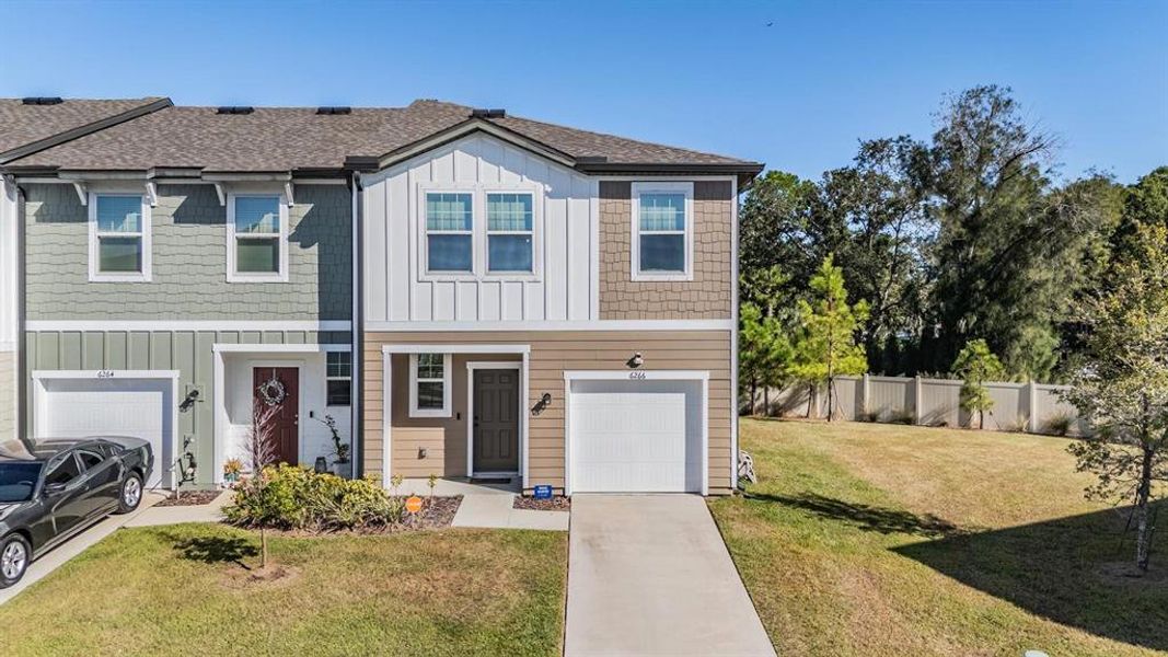 Front exterior of a new home in Dug Creek, Gibsonton, FL, highlighting curb appeal (Image 1). Front exterior of a new home in Dug Creek, Gibsonton, FL, highlighting curb appeal (Image 1).