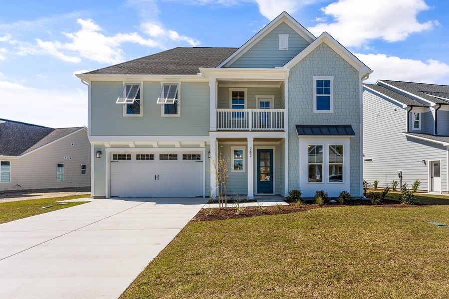 Representative exterior photo of a completed home built from the The Highland by RobuckHomes in Windwater, Hampstead, NC (Image 24).