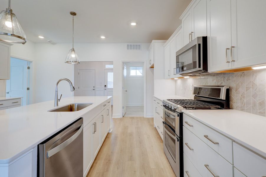 Representative furnished interior of a home built from the Elm by McKee Homes in Coastal Haven, Leland (Image 16).