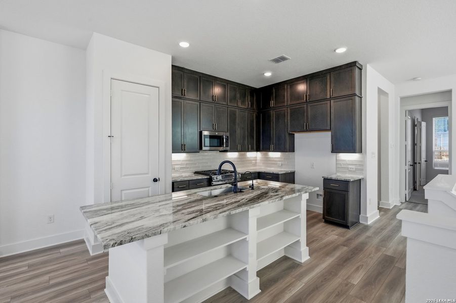Furnished interior view inside a new home in Rose Hill, San Antonio (Image 18).