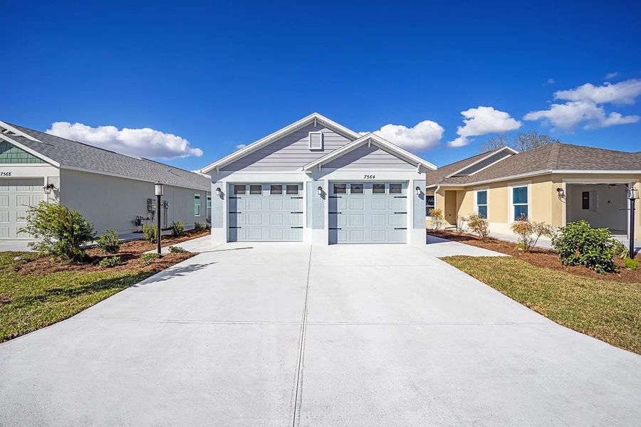Representative exterior photo of a completed home built from the Charlotte by The Villages in The Villages/Courtyard Villas, The Villages, FL (Image 1). Representative exterior photo of a completed home built from the Charlotte by The Villages in The Villages/Courtyard Villas, The Villages, FL (Image 1).