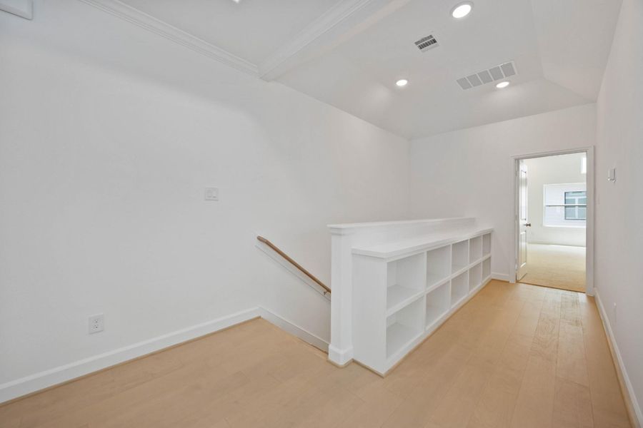 Built-in shelving adds both charm and storage—ideal for your favorite reads, board games, or a curated coffee table book moment.