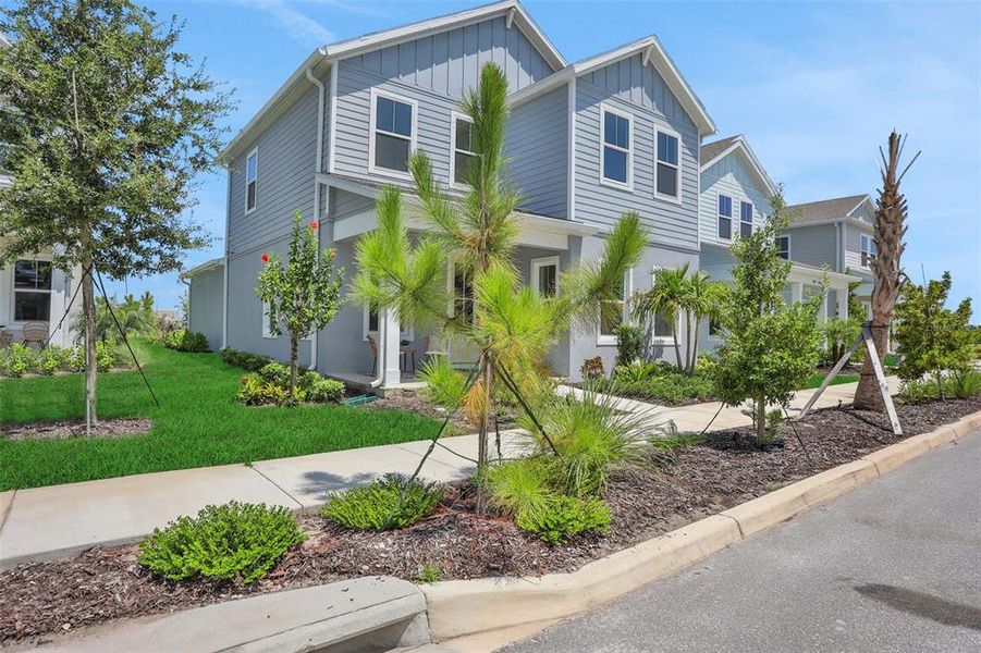 Front exterior of a new home in Bungalow Walk at Lakewood Ranch, Lakewood Ranch, FL, highlighting curb appeal (Image 15).