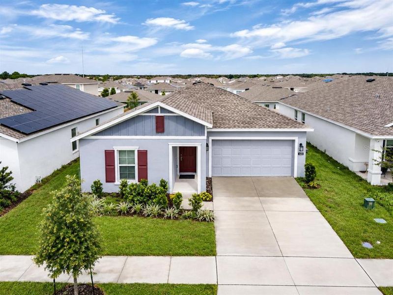 Front exterior of a new home in Lawson Dunes, Haines City, FL, highlighting curb appeal (Image 2). Front exterior of a new home in Lawson Dunes, Haines City, FL, highlighting curb appeal (Image 2).